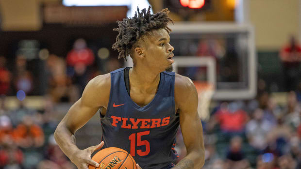 Dayton’s Daron Holmes II holds the basketball